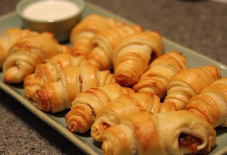 Delicious Bacon-Cheeseburger Crescents ready to serve, perfect for game day or parties.