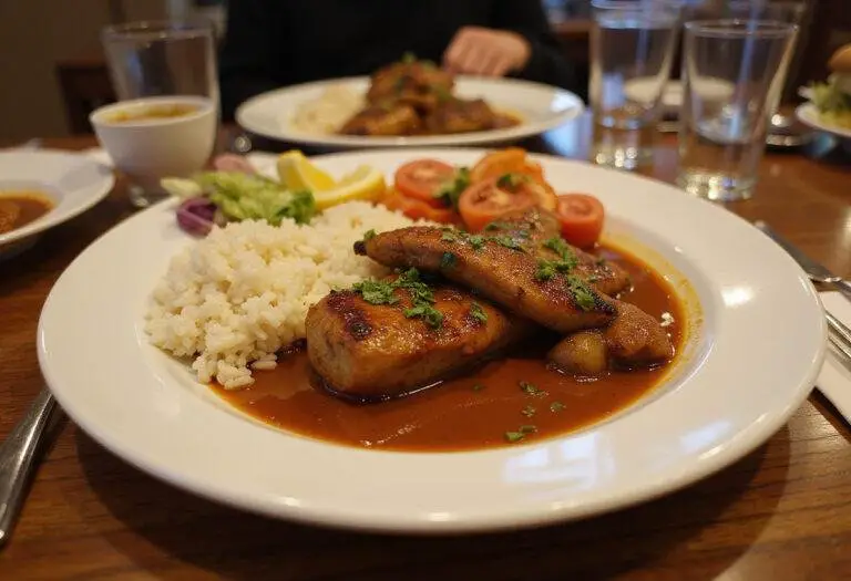Savor a delightful presentation of grilled meat with arbol pepper sauce, accompanied by rice and vegetables, perfect for sharing.