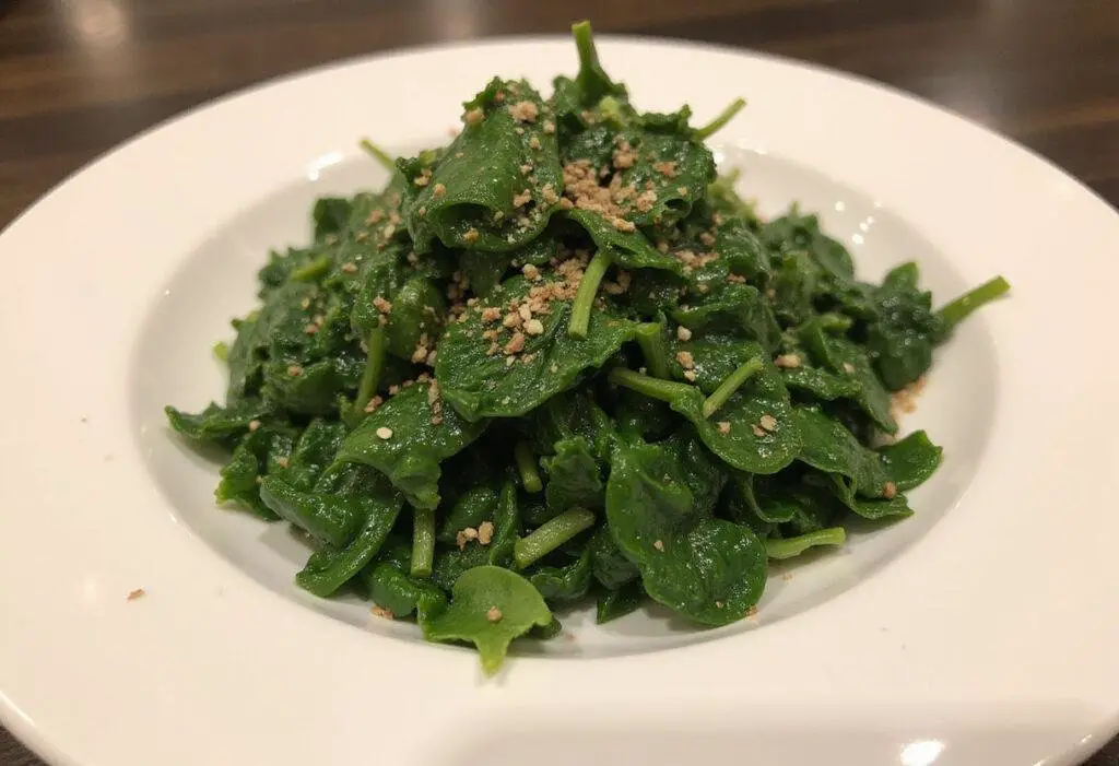 Plated chopped spinach sensation, garnished and ready to serve, showcasing the vibrant colors and flavors of the dish.