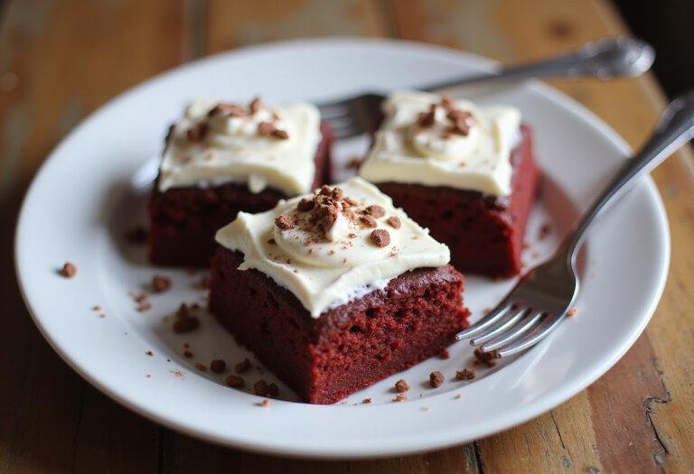 Deliciously plated red velvet brownies with cream cheese frosting, showcasing the final result of this enticing red velvet brownie recipe.
